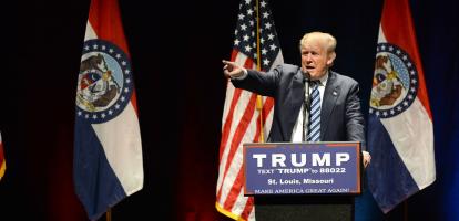 Donald Trump points out to the crowd while making a speech