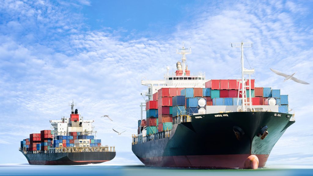 Two cargo ships on the ocean.