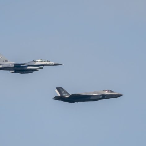 Lockheed Martin F-35 Lightning II and F16 Fighting Falcon of the Dutch Air Force flying in formation during a demonstration flight over The Netherlands to show the new F35 Joint Strike Fighter.